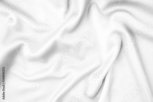 Abstract white fabric texture background. Wavy white cloth.