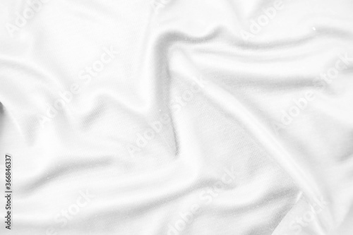 Abstract white fabric texture background. Wavy white cloth.