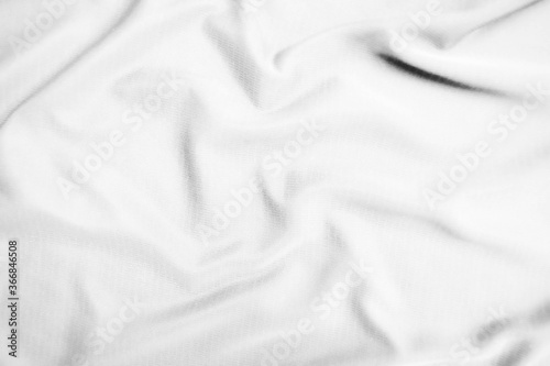 Abstract white fabric texture background. Wavy white cloth.