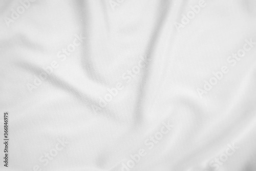 Abstract white fabric texture background. Wavy white cloth.