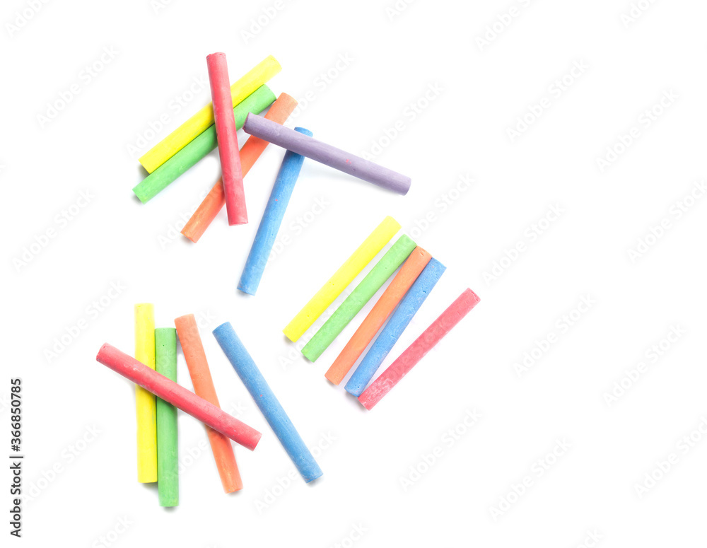 chalks in a variety of colors arranged on a white background