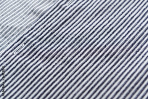 Close up of men's striped shirt. Cotton fabric. 