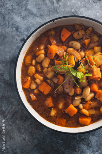 plant-based food, vegan sweet potato and pumpkin stew with butter beans and roasted veggies