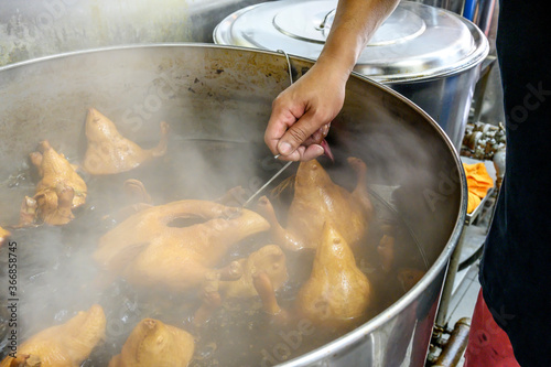 braised duck cooking in a pot