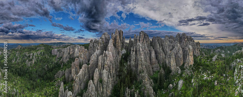 panorama of needles spires with storm clouds in the background off needles highway in black hills of South Dakota