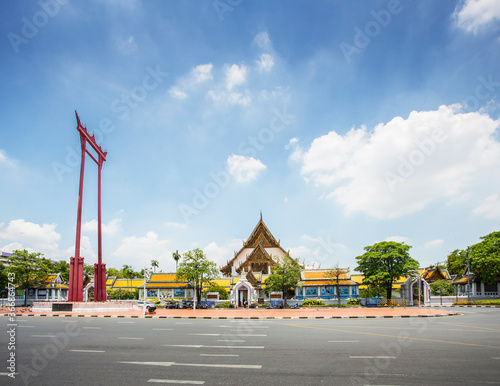 The giant swing (Sao Ching Cha) and Wat Suthat temple in Bangkok, Thailand photo