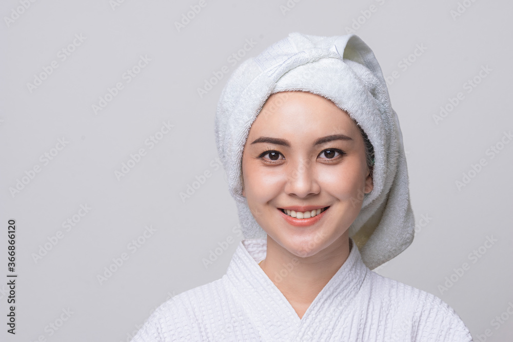 Obraz premium Portrait Asian woman smiling in spa dress in studio grey background, Beautiful girl healthcare.