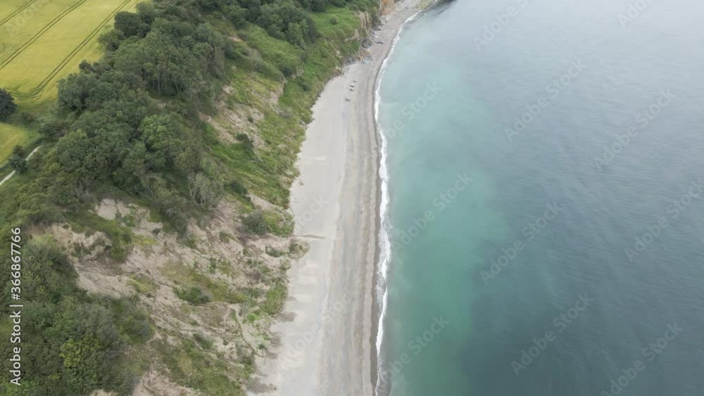 Beautiful Paradise With Turquoise Blue Sea And Lush Trees In Greystones South Beach, Ireland - aerial Beautiful Paradise With Turquoise Blue Sea And Lush Trees In Greystones South Beach, Ireland - aerial