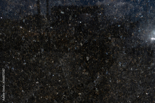granite texture. stone dark background glare
