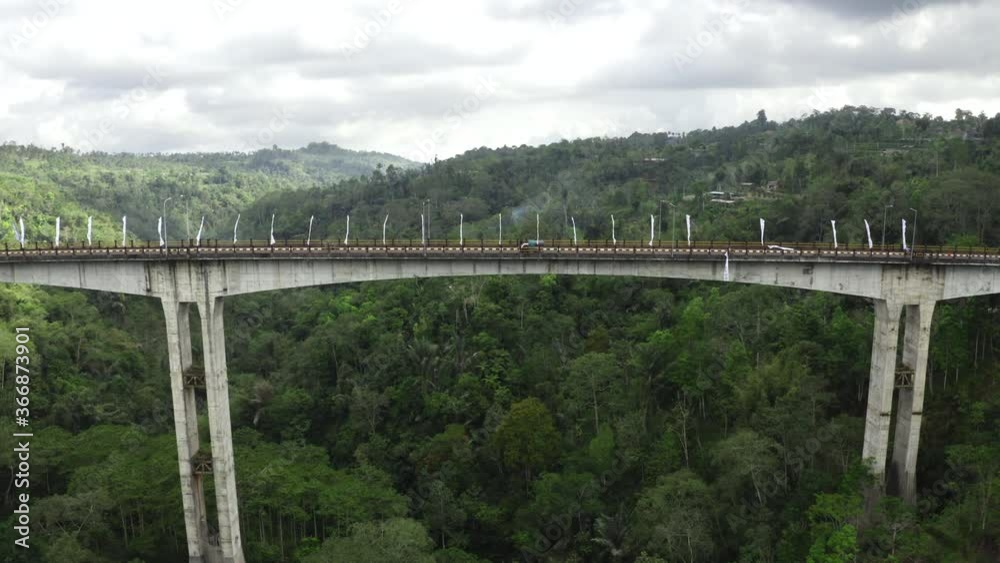 Aerial Shot Of Cars Travelling On Tukad Bangkung Bridge, Bali Destination Aerial Shot Of Cars Travelling On Tukad Bangkung Bridge, Bali Destination