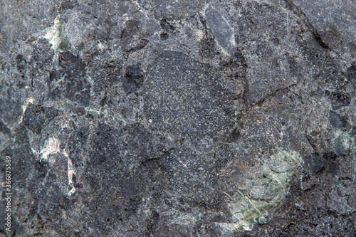 gray stone texture with inclusion and homogeneous background of the rock