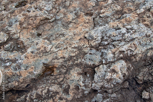 gray stone texture with inclusion and homogeneous background of the rock