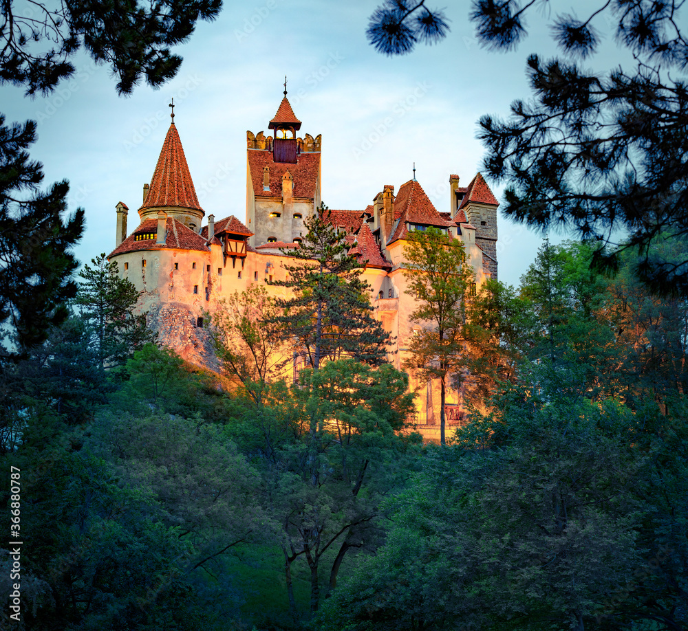Gloomy evening view of Bran Castle. Dark summer scene of medieval landmark - Dracula fortress in Transylvania, Romania, Europe. Traveling concept background. Gloomy evening view of Bran Castle. Dark summer scene of medieval landmark - Dracula fortress in Transylvania, Romania, Europe. Traveling concept background.