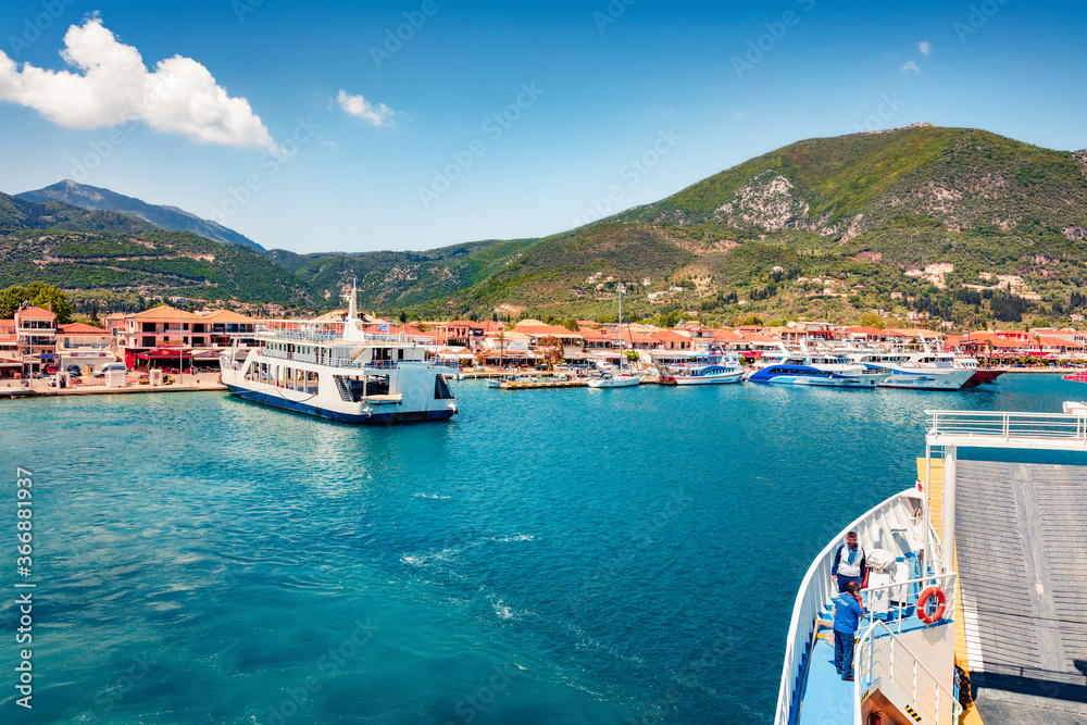 View from ferry. Impressive spring cityscape of Nydri port. Captivating morning seascape of Ionian Sea.Astonishing outdoor scene of Lefkada island, Greece, Europe. Traveling concept background.