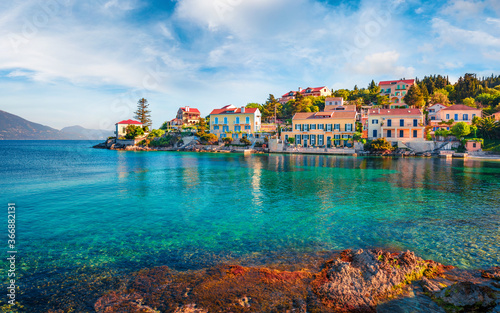 Exciting spring cityscape of Fiskardo town with Zavalata Beach. Romantic morning seascape of Ionian Sea. Wonderful outdoor scene of Kefalonia island, Greece, Europe. Traveling concept background.