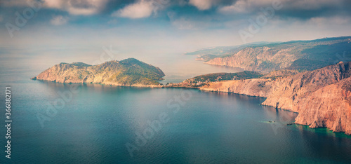 Panoramic spring view of Asos peninsula and town. Dramatic morning seascape of Ionian Sea. Great outdoor scene of Kephalonia island, Greece, Europe. Traveling concept background.