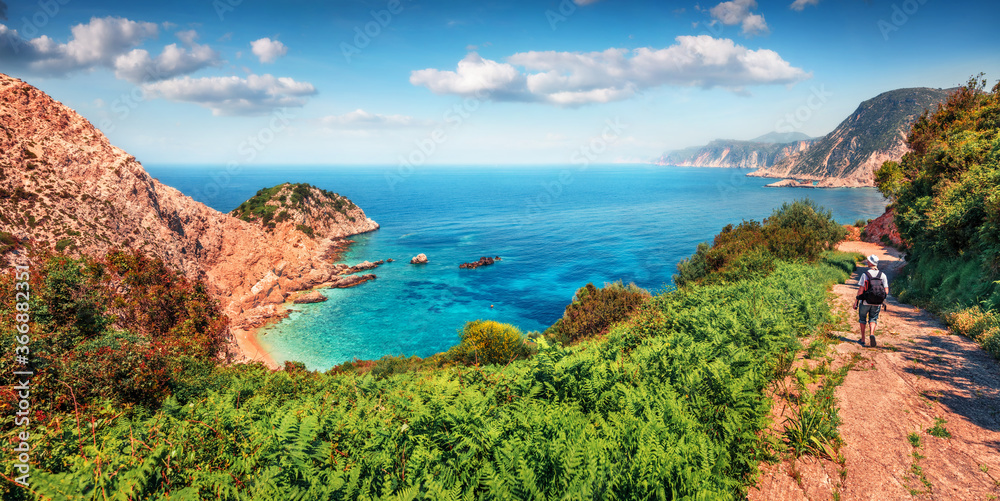 Fototapeta premium Abandoned country road to Agia Eleni beach. Amazing morning seascape of Mediterranean Sea. Beautiful outdoor scene of Cephalonia island, Greece, Europe. Traveling on Ionian Islands.