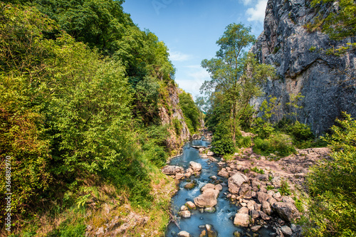 Stunning summerview of Cheile Turzii / Turzii's Gorge canyon, large natural preserve with marked trails for scenic gorge hikes crossing streams & bridges. Beauty of nature concept background. photo