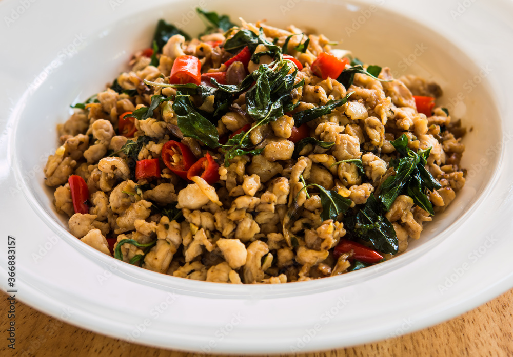 Stir fried chicken with basil, Thai famous street food Stir fried chicken with basil, Thai famous street food