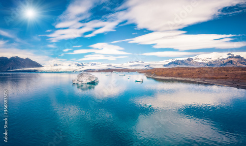 Floating of blue icebergs in Jokulsarlon Glacier Lagoon. Exotic summer scene of Vatnajokull National Park. Magnificent morning on Iceland, Europe. Beauty of nature concept background.
