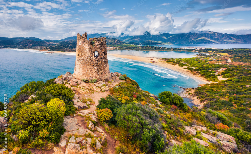 View from flying drone. Colroful spring view of Torre di Porto Giunco tower on Carbonara cape. Fantastic morning scene of Sardinia island, Italy, Europe. Colorful Mediterranean seascape.