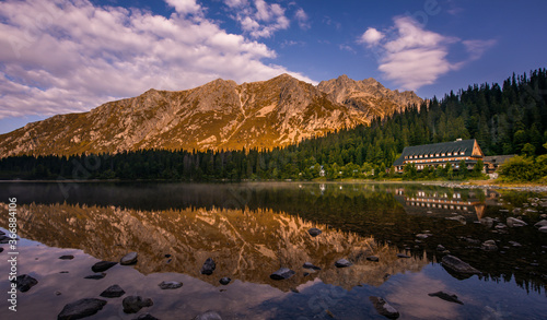 Sunset panorama in High Tatras mountains national park. Mountain popradske lake in Slovakia. photo