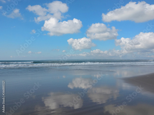 blue sky beach paradise white sandy dramatic ocean blue sky cloud and rough blue water © Visualism