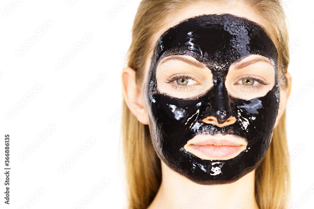 Woman with black peel off mask on face Woman with black peel off mask on face