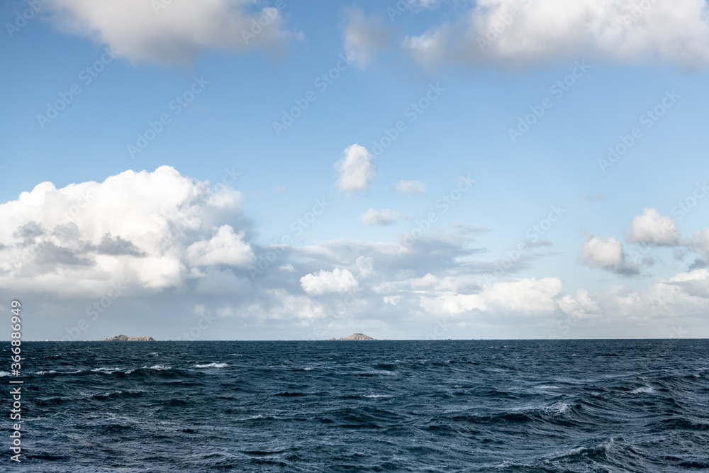Fototapeta premium The Atlantic ocean in Bretagne France with a cloudy friendly sky and no boat.