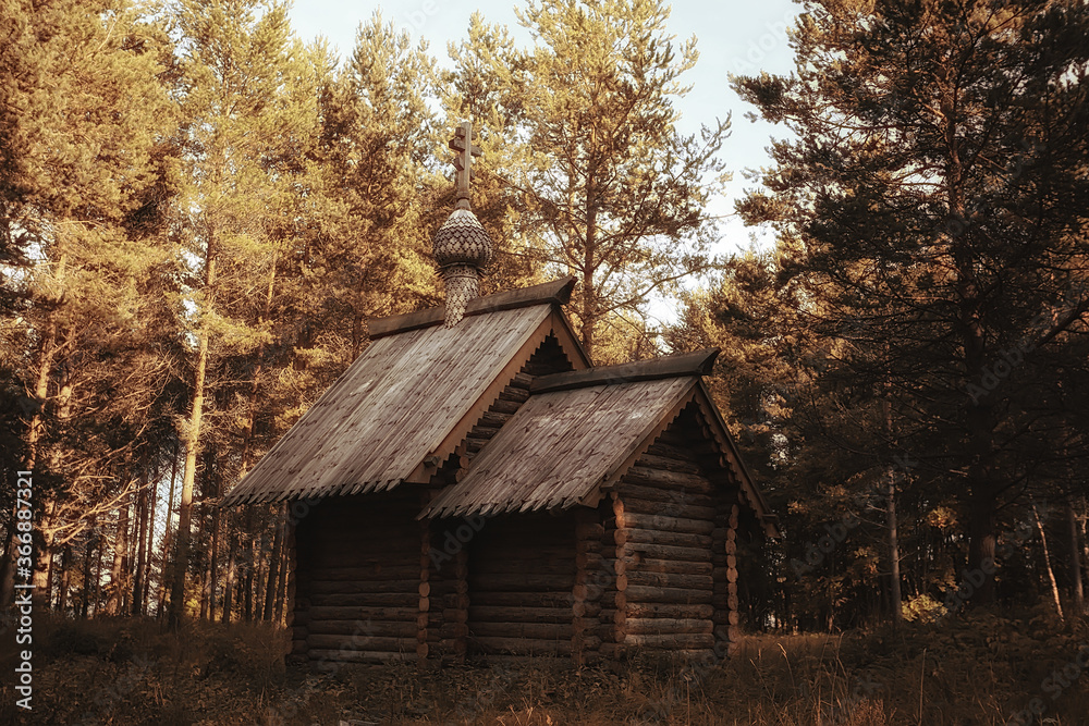 small wooden church in the forest, summer landscape, native orthodox faith concept