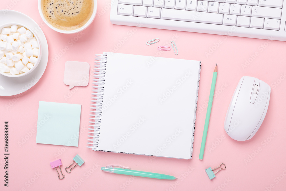 Office workplace desk table with computer, supplies, coffee and marshmallow in pastel colors. Top view Office workplace desk table with computer, supplies, coffee and marshmallow in pastel colors. Top view