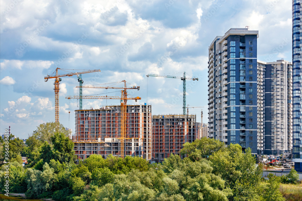 Modern construction of residential high-rise complexes using tower cranes and the method of monolithic frame technology. Modern construction of residential high-rise complexes using tower cranes and the method of monolithic frame technology.