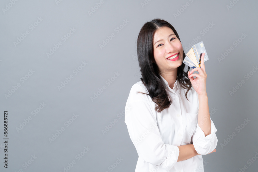 Young asian woman happy smiling present credit card Young asian woman happy smiling present credit card