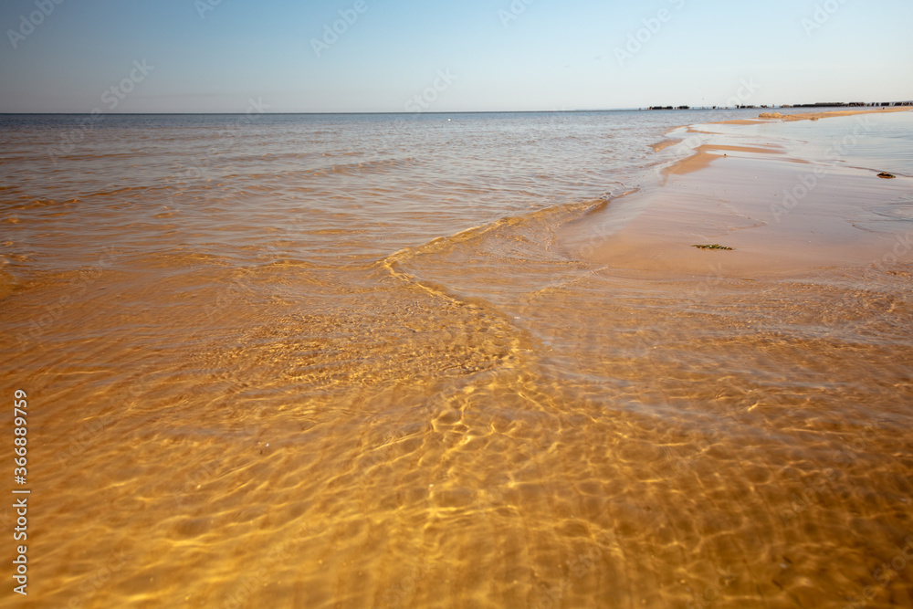 Beautiful sandy beach on a sunny summer day. Baltics. The coast of the Gulf of Finland. Estonia. Ust-Narva. Beautiful sandy beach on a sunny summer day. Baltics. The coast of the Gulf of Finland. Estonia. Ust-Narva.