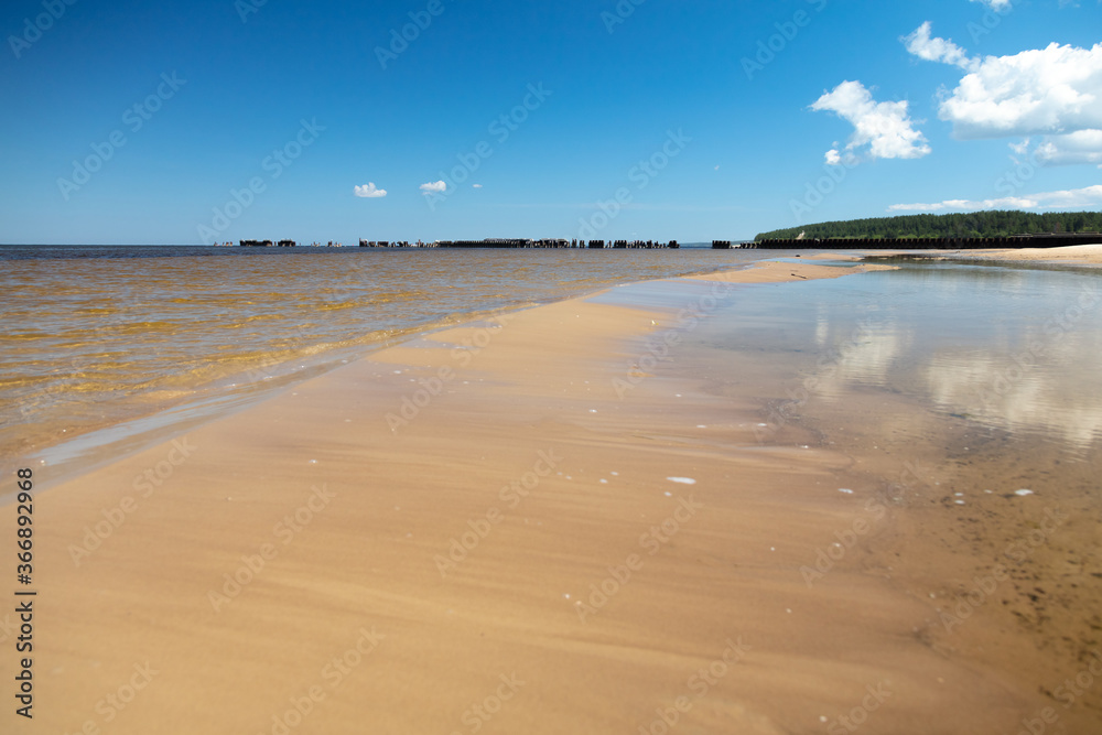 Beautiful sandy beach on a sunny summer day. Baltics. The coast of the Gulf of Finland. Estonia. Ust-Narva.