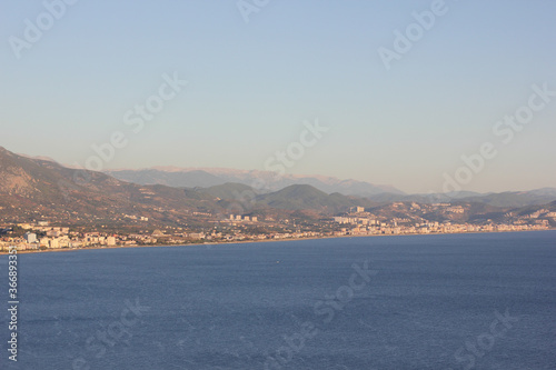 Alanya, TURKEY - August 10, 2013: Travel to Turkey. Clear blue sky. The waves of the Mediterranean Sea. Water surface. Coast.
