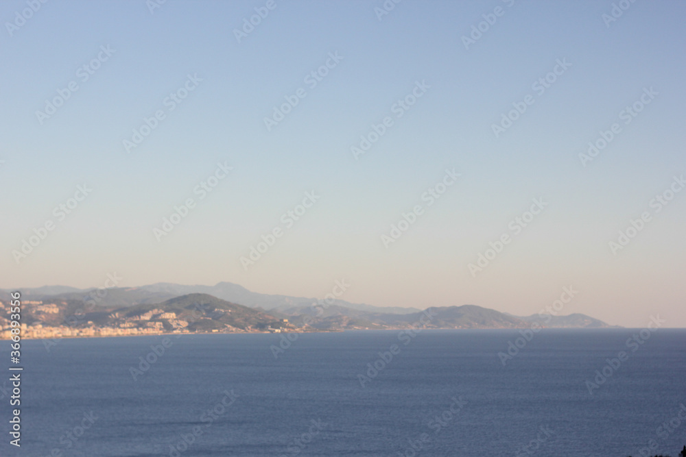 Alanya, TURKEY - August 10, 2013: Travel to Turkey. Clear blue sky. The waves of the Mediterranean Sea. Water surface. Coast.