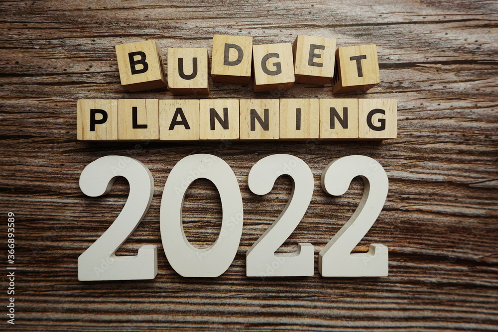 Budget Planning 2022 alphabet letters on wooden background Budget Planning 2022 alphabet letters on wooden background
