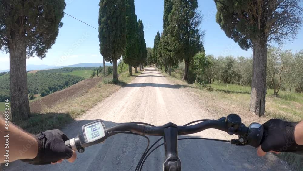 pov e bike along cypress road in Tuscany