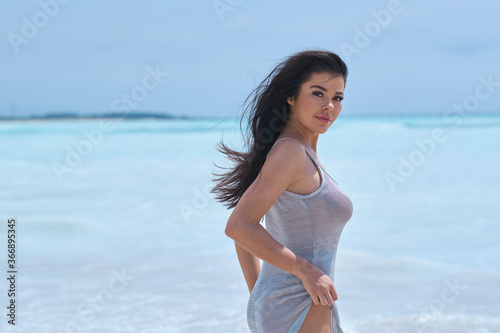 Sexy woman in a dress on the ocean coast © ZoomTeam
