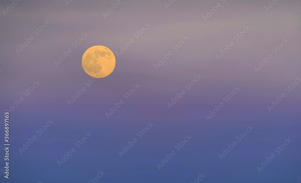 Full moon isolated on violet background, creative design