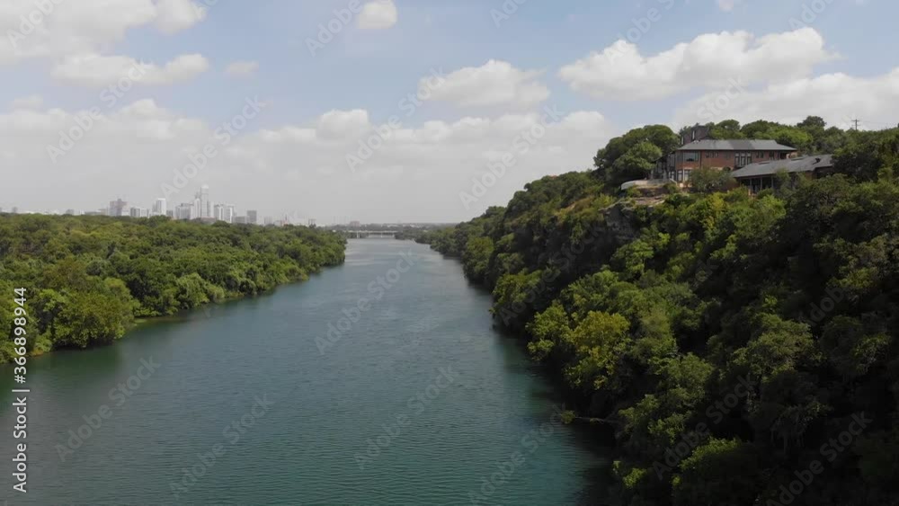 Rising shot of town lake in Austin TX, Shot slowly pans to reveal the cities downtown skyline in the background. Rising shot of town lake in Austin TX, Shot slowly pans to reveal the cities downtown skyline in the background.