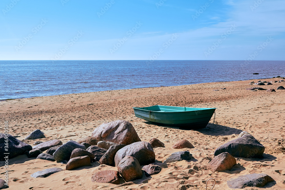 Boat in daylight at Baltic sea shore in Tuja, Latvia Boat in daylight at Baltic sea shore in Tuja, Latvia