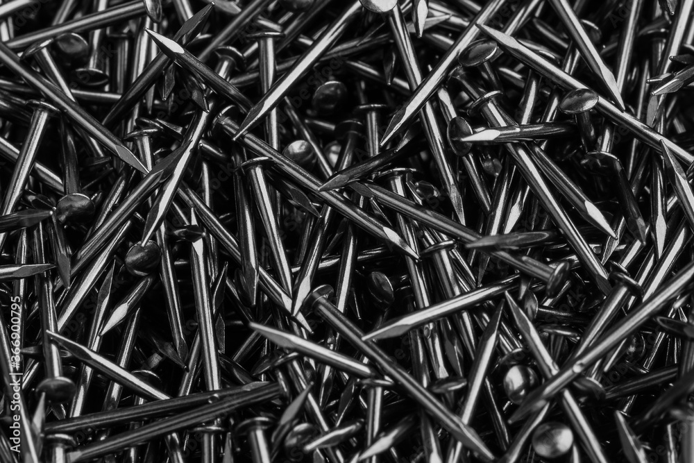 Abstract background of many small shiny nails for footwear production Abstract background of many small shiny nails for footwear production