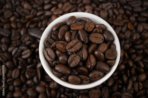 A cup filled with coffee grains.
