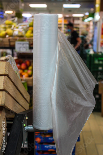 A roll of polyethylene unsustainable bags in a supermarket