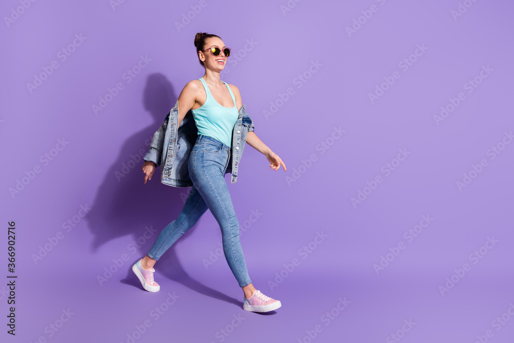 Full size photo of nice pretty girl go walk copyspace enjoy spring free time weekend wear good look youth style outfit isolated over violet color background