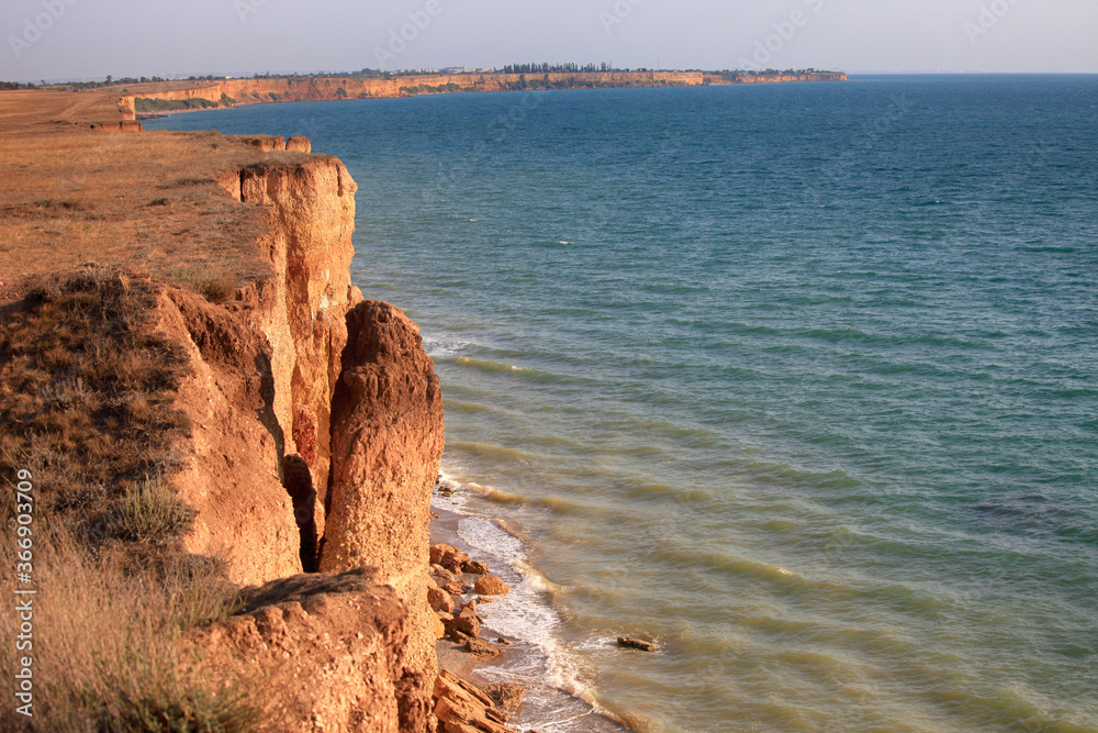 Beautiful seascape in the Crimea. The steep crumbling coast of the Black Sea