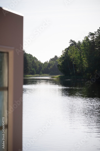 A door open to a lake view © oscarhelgstrand