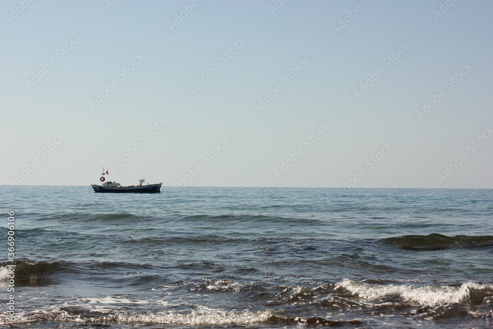 Alanya, TURKEY - August 10, 2013: Travel to Turkey. Beaches on the sea. Waves on the Mediterranean coast. Alanya, TURKEY - August 10, 2013: Travel to Turkey. Beaches on the sea. Waves on the Mediterranean coast.